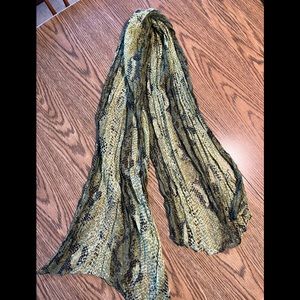 Greens patterned scarf.